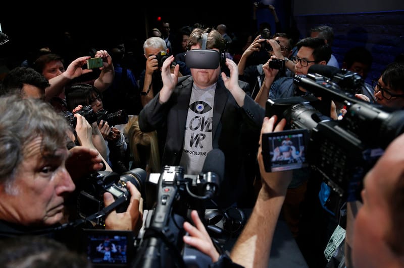 "Oculus founder Palmer Lucky is surrounded by photographers after introducing the Rift virtual reality headset during a press event in San Francisco, Calif., Thursday, June 11, 2015. (Karl Mondon/Bay Area News Group)"