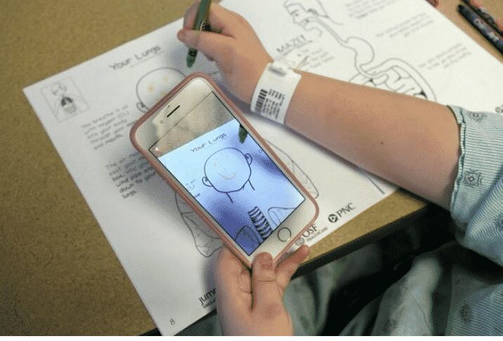 AR Activity Book in use at OSF Healthcare Children’s Hospital of Illinois.