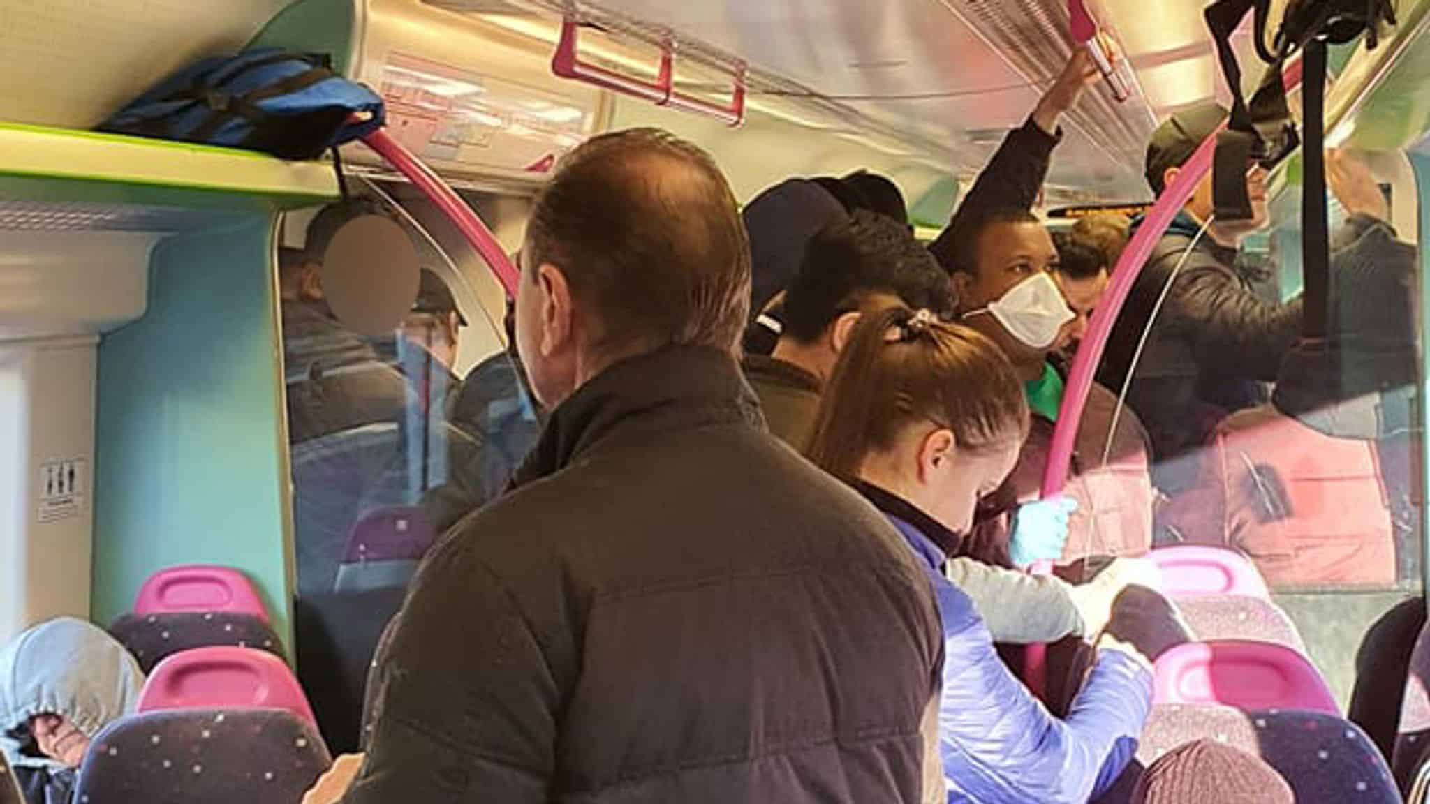 Crowds ignore social distance guidelines on Monday morning commute on London's Tube.