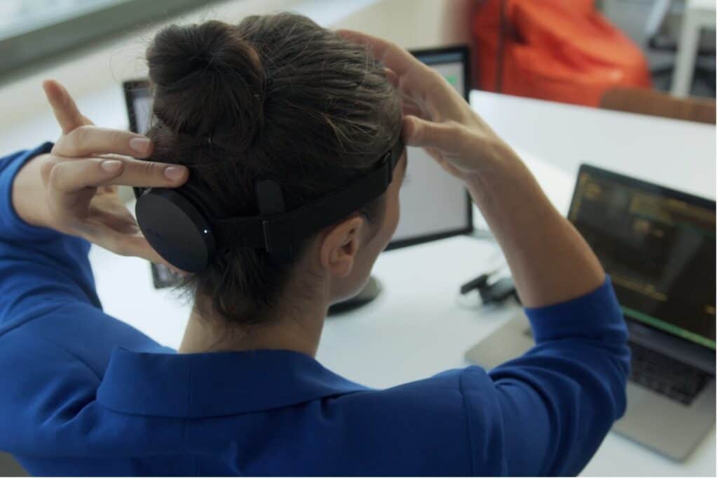 A woman wearing NextMind's developer kit.